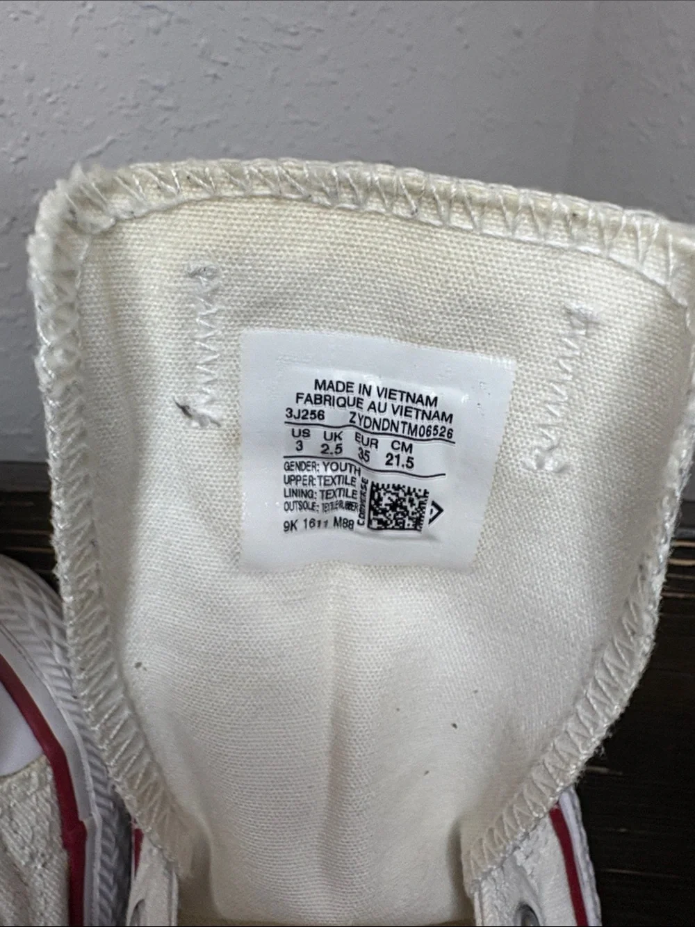 Converse Kids Slip-On Canvas Sneakers in Cream with Red Trim